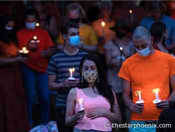 In photos: Candle-light vigil marks end of a different Canada Day in Saskatoon