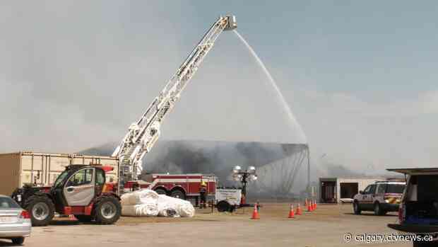 Business as usual, as southern Alberta hay plant fire continues to smoulder