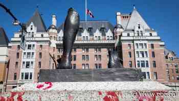Protesters toss statue of explorer James Cook into Victoria harbour; totem pole later burned