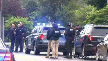 Massachusetts police standoff with heavily armed men ends in 11 arrests