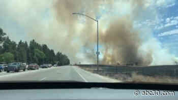 Traffic stalled as crews battle large fire near Fresno's Woodward Park