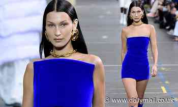 Bella Hadid stuns in a tiny electric blue minidress and knee-high PVC boots