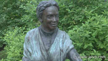 Tourists help bring attention to white supremacist vandalism at Jamestown's Underground Railroad art exhibit