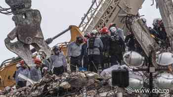 Storm threat hangs over renewed search at Florida condo site