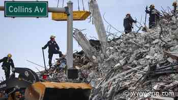 No positive signs in search for survivors in condo collapse rubble as four more bodies found, officials say