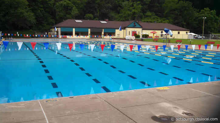 People Come Together At Highland Park Pool To Cheer On Young Child