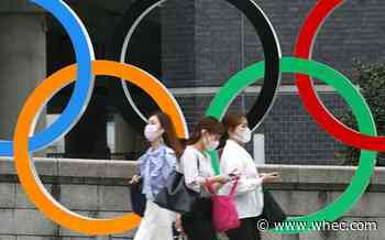 Japan to declare virus emergency lasting through Olympics