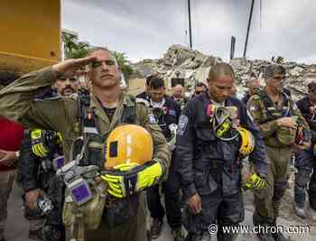 Recovery workers pledge to press forward in condo collapse