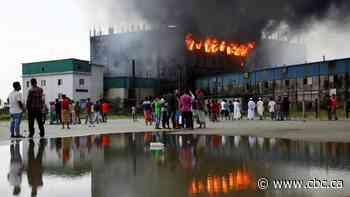 Dozens killed in Bangladesh factory fire as workers illegally locked inside