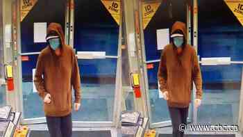 Man wearing blue mask connected to 9 robberies in east Calgary - CBC.ca