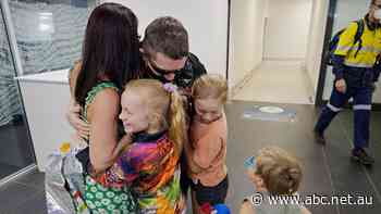 Emotional homecoming for 700 miners confined to fortnight of desert isolation