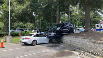 Jeep lands on car in Raleigh McDonald's parking lot after being struck by stolen car on Poole Road