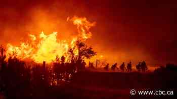 Firefighters struggle to contain California wildfires as heat wave swelters western U.S.