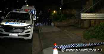 Police guard Bondi apartment block after coronavirus spreads between residents - 9News