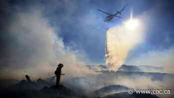 Firefighters make progress against large fires in California, Oregon
