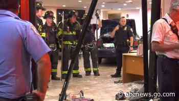 Woman at large after plowing car through hotel-turned-homeless shelter, 3 injured