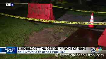 'It's eating away at our yard': Houston family in fear dealing with growing sinkhole in front yard - KPRC Click2Houston