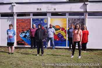 Fruit inspired mural printed on side of community centre