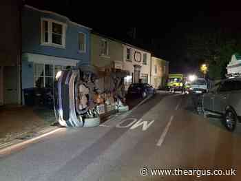 Driver collides with parked car and flips in Hurstpierpoint