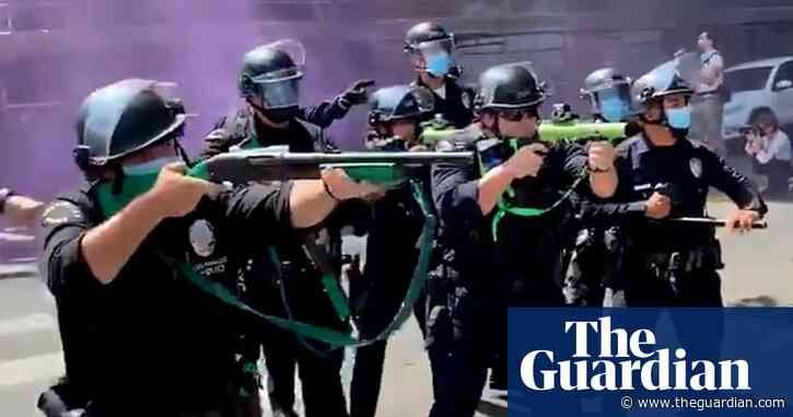 Police fire rubber bullets after anti-trans rights protest at Los Angeles spa turns violent – video