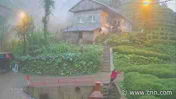 CCTV footage shows family narrowly escaping mudslide