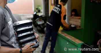 Indonesian soup kitchen brings food to COVID-19 patients stuck at home - Reuters