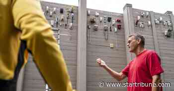 A St. Louis Park highway noise barrier has become a growing art wall of old telephones