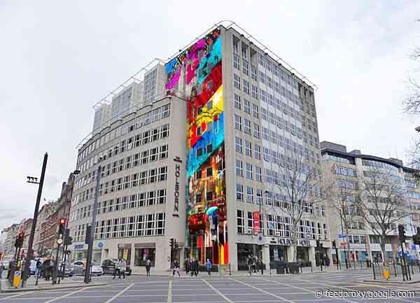 Huge mural appears on the side of a Holbon hotel