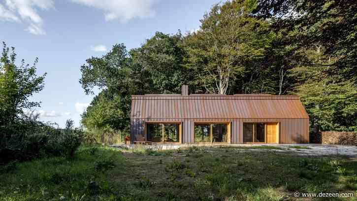 The Author's House is a copper-clad cabin in a Danish forest