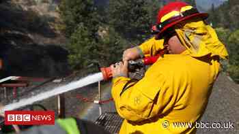 Wildfires: Firefighters battle blaze from top of moving train