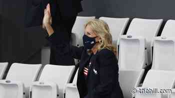 US athletes chant 'Dr. Biden' as first lady cheers swimmers