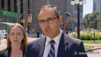 Lawyer of man charged in police officer's death says public should await complete story