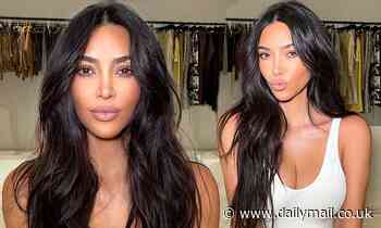 Kim Kardashian shows off her 'casual glam' as she relaxes in a white tank top and sweatpants