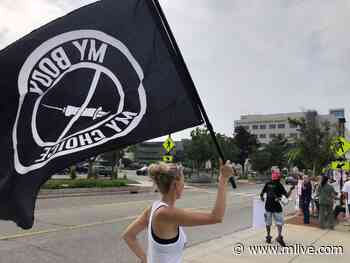 Protesters of Trinity Health’s coronavirus vaccine mandate line street outside Grand Rapids hospital - MLive.com