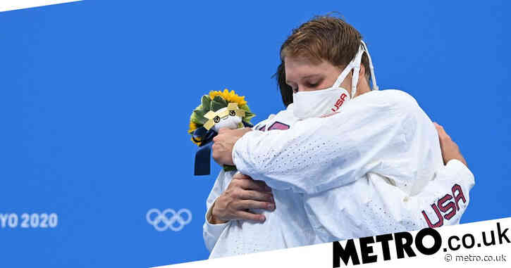 Olympic athletes told to stop hugging each other on podium