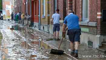 Belgians reeling after more heavy flooding rips apart streets, washes away cars