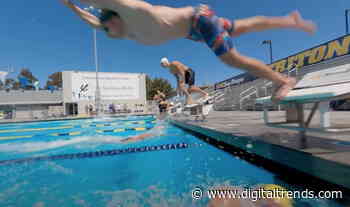 FPV drone video tracks swimming race before ending with a splash