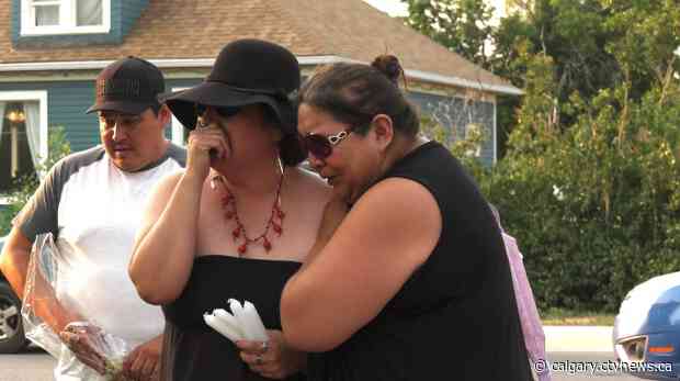 'We're going to get justice': Family and friends attend vigil for Lane Tail Feathers