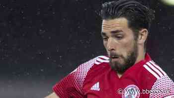 Adam Phillips: Burnley loan midfielder back to Morecambe