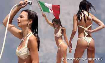 Emily Ratajkowski showers away the salt water after emerging from a dip in the Tyrrhenian Sea