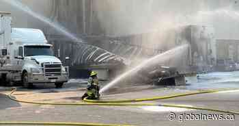 Trailer fire at southeast Calgary commercial building injures 3 people - Global News