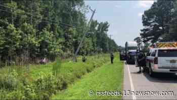 Suffolk crash downs power lines, shuts down road