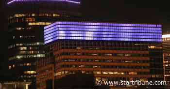Who controls the colorful lights in Minneapolis' night skyline?
