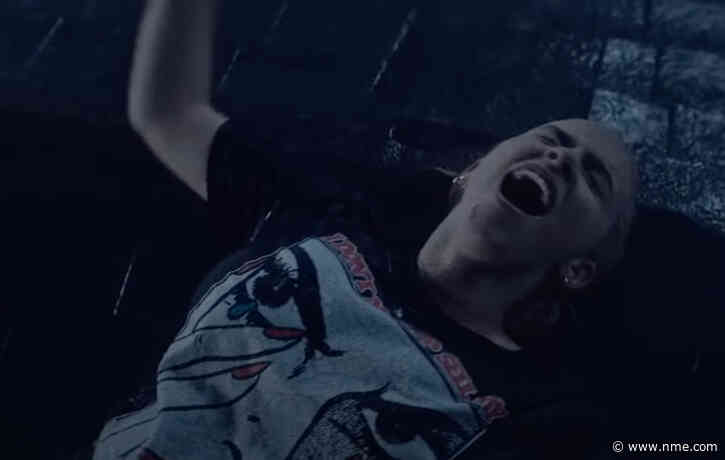 Billie Eilish fights a literal flood of emotion in striking new video for ‘Happier Than Ever’