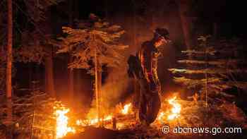 California wildfire flares but within line crews have built