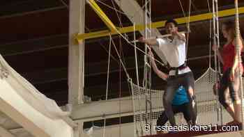 Swinging through the air with the greatest of ease, it's Guy Brown on a trapeze