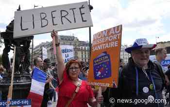 French police clash with anti-virus pass protesters in Paris - Associated Press