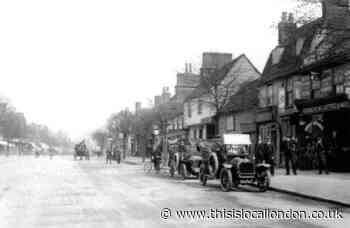 Two vintage cars pictured outside Essex garage a century ago