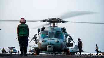 U.S. navy says drone strike hit oil tanker off Oman, killing 2, as Israel and U.K. blame Iran