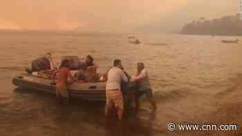 Hundreds flee popular tourist resort by boat as wildfires blaze in Turkey